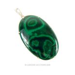 A sterling silver and large, oval-shaped, malachite cabochon pendant