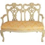 A late 19th early 20th century Chippendale revival Carved Ribbon Settee.
