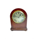 An Edwardian Asprey mahogany mantel clock, having a circular silver dial with Roman Numerals and