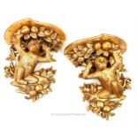 A pair of gilt wall brackets