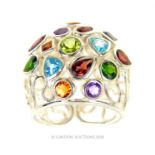 A sterling silver wire-work ring set with gemstones