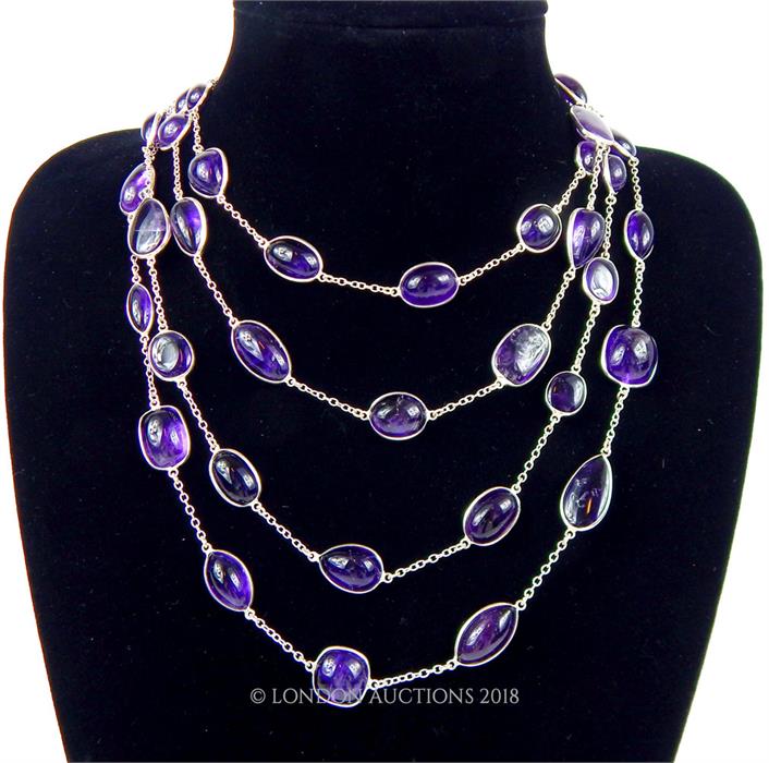 An elegant, very long, sterling silver and amethyst cabochon necklace