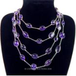 An elegant, very long, sterling silver and amethyst cabochon necklace