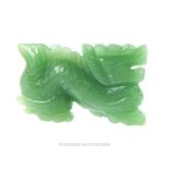 A Chinese, carved, green jade dragon