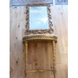 A Rococo style giltwood console table and mirror