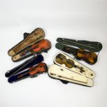 Four children's, cased violins with bows