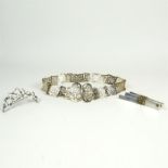 Two silver brooches and an Edwardian silver plated, pierced belt