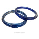 A rare, pair of Roman, dark-blue glass bangles (1st - 3 rd C AD)