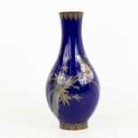 A Chinese cloisonne vase with a midnight-blue ground