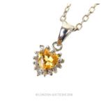 A 14 ct white gold, heart shaped, citrine and diamond pendant necklace.