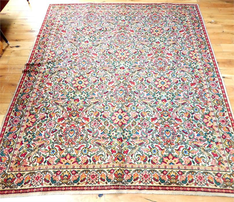 A large, colourful, Persian, woollen carpet