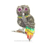 A silver, plique a jour, owl brooch with ruby eyes