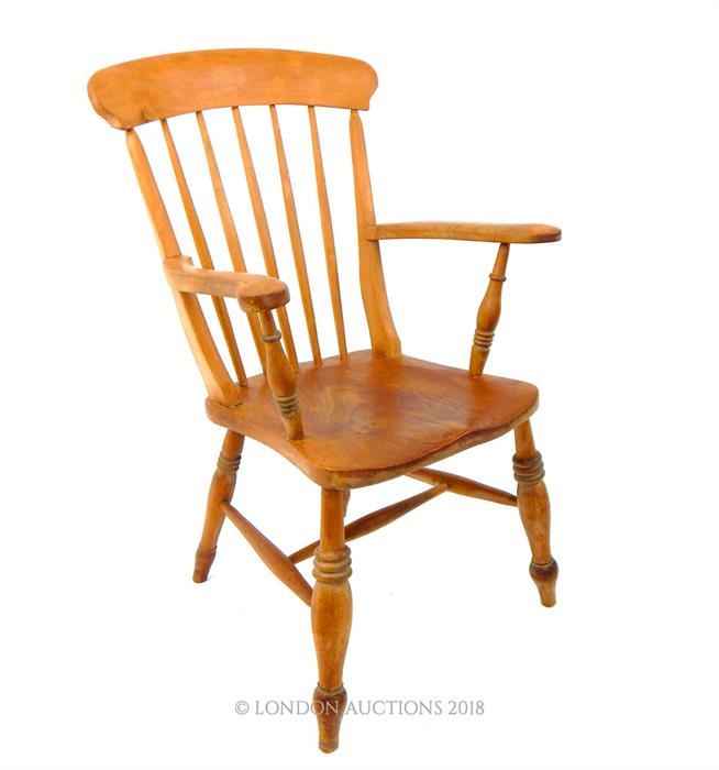 A late 19th century, elm chair