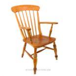 A late 19th century, elm chair