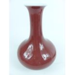 A Chinese porcelain vase, with a monochrome purple glaze