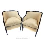 A matching pair of tub chairs with natural, linen upholstery