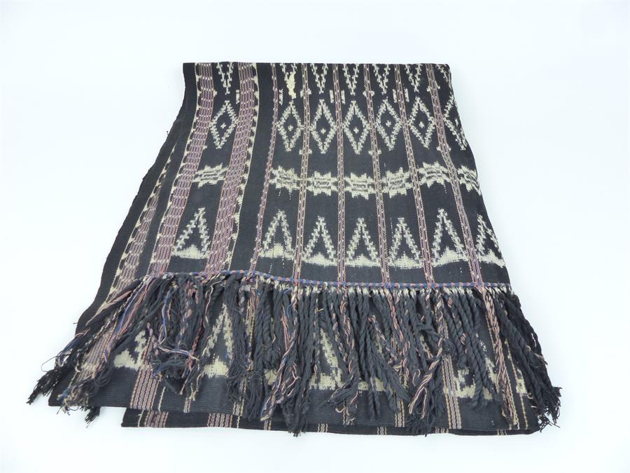 An unusual black ceremonial Pua textile