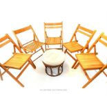 Five, folding wooden chairs and a bamboo seat with cushion