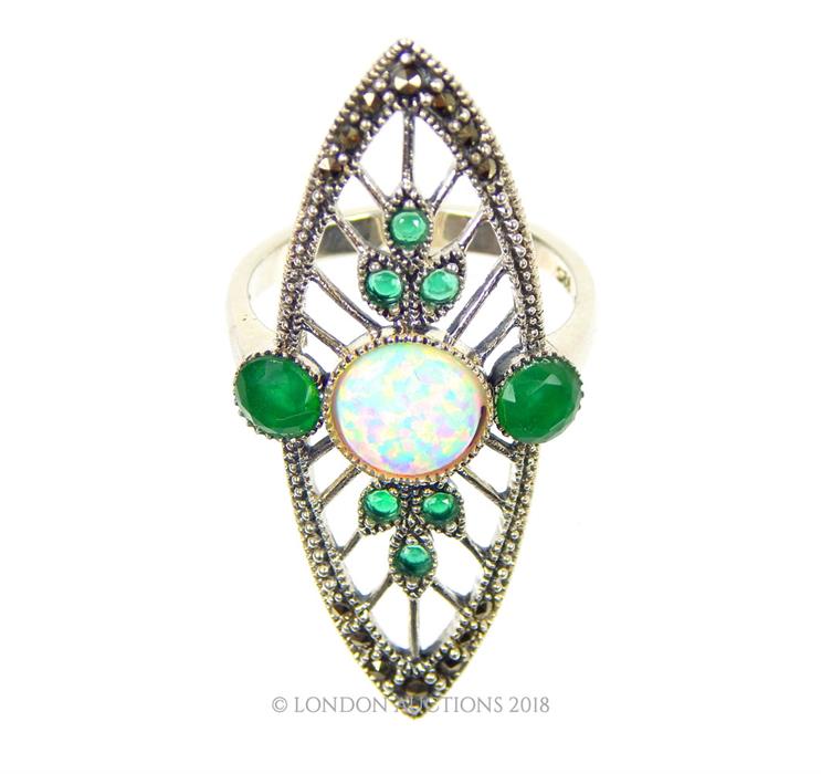 An Art Deco -style silver ring set with emeralds and opalites