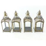 A set of four, large, squared, gilt storm lanterns