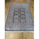 A Turkish, Bokhara, silver, black and terracotta coloured rug