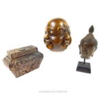 Two bronze Buddha head sculptures and a Japanese box decorated with dragons