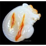 A Chinese, carved white and orange agate, dragon