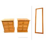 A pair of solid, pine bedside cupboards with a pine wall mirror