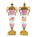 A pair of French style porcelain vases with gilt metal mounts