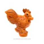 A Japanese wooden netsuke in the form of a cockerel