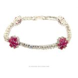 A silver, white crystal and ruby bracelet
