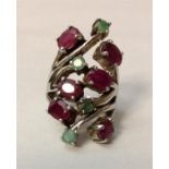 A white metal, large, vintage natural ruby and emerald ring