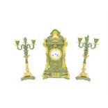 A painted and gilt metal clock garniture