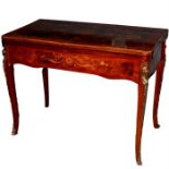A Louis XV-style, gilt-metal mounted marquetry inlaid figured walnut card table