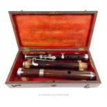 A late 19th century, cased, Adler, rosewood flute