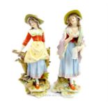 A pair of late 19th century Continental porcelain figures of ladies