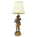 A weighty, bronzed, lamp adorned with a cavalier gentleman (with shade)