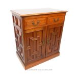 An Edwardian walnut side cabinet