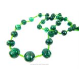 A natural, malachite beaded, graduated necklace