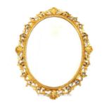 A gilt wood oval wall mirror