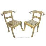 A pair of white metal encased chairs