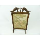 An Edwardian fruitwood George II style firesceen