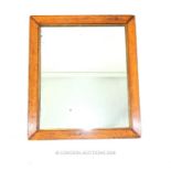 A Victorian rectangular wall mirror in a birds eye maple frame