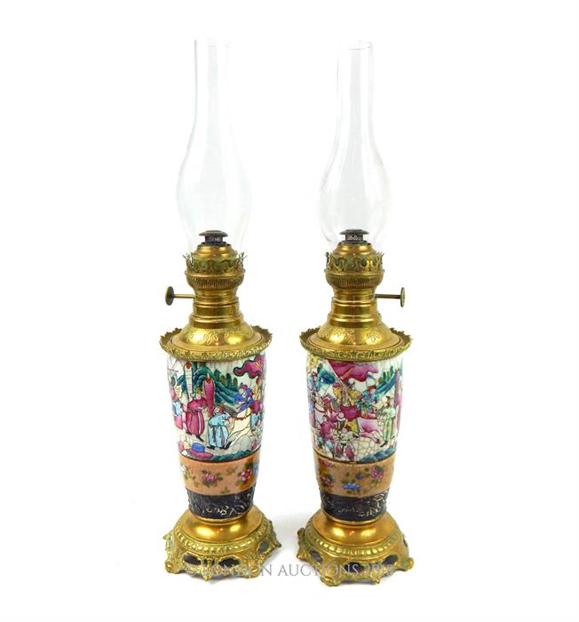 A pair of Famille Rose Victorian Oil Lamps