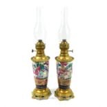 A pair of Famille Rose Victorian Oil Lamps