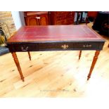 A yew wood and ebonised writing table