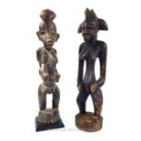 Two carved Senufo Female Figures Ivory Coast