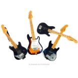 Four children's electric guitars