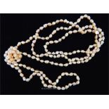 A long, 1920's style, strand of pink, baroque, freshwater pearls