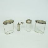 A Victorian silver perfume bottle and three jars with silver lids